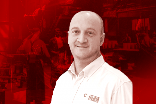 A man in white shirt on a red background